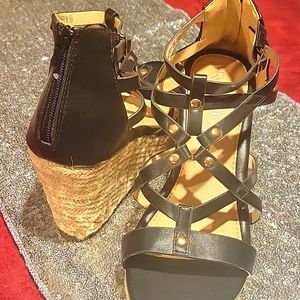 Black and tan gladiator style wedges